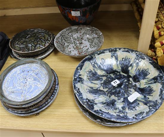 A collection of Art pottery plates and dishes, signed
